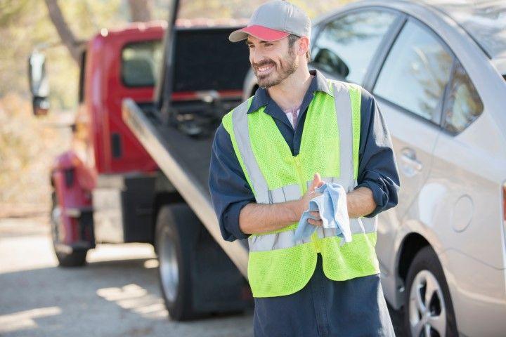 Happy tow truck driver